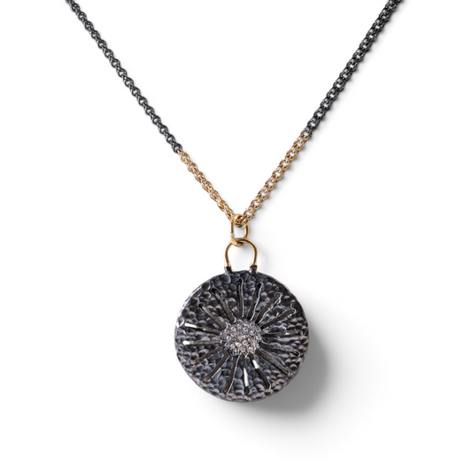 Trebor Style two-tone sand dollar pendant in oxidized sterling silver and 14k gold with pave white sapphires.