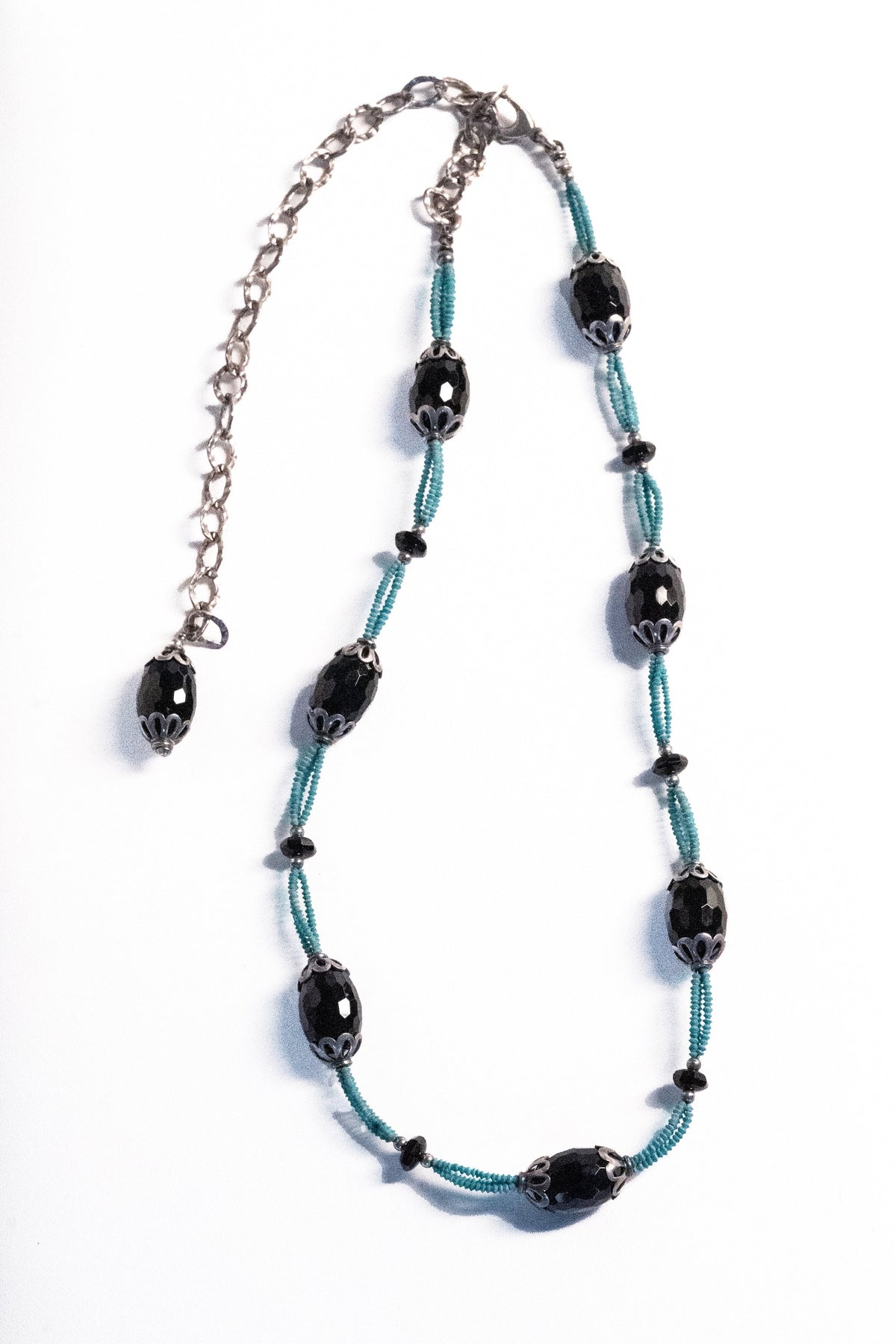 Trebor Style black agate and turquoise thread necklace with silver filigree caps and adjustable curb-link chain.