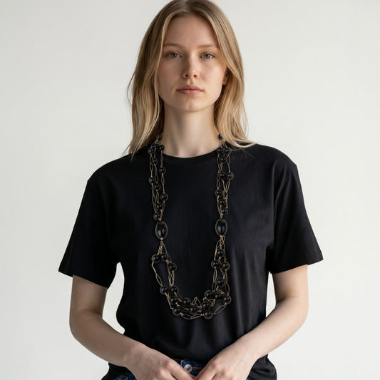 Trebor Style long triple strand necklace featuring black onyx beads and rose gold plated sterling silver open links.