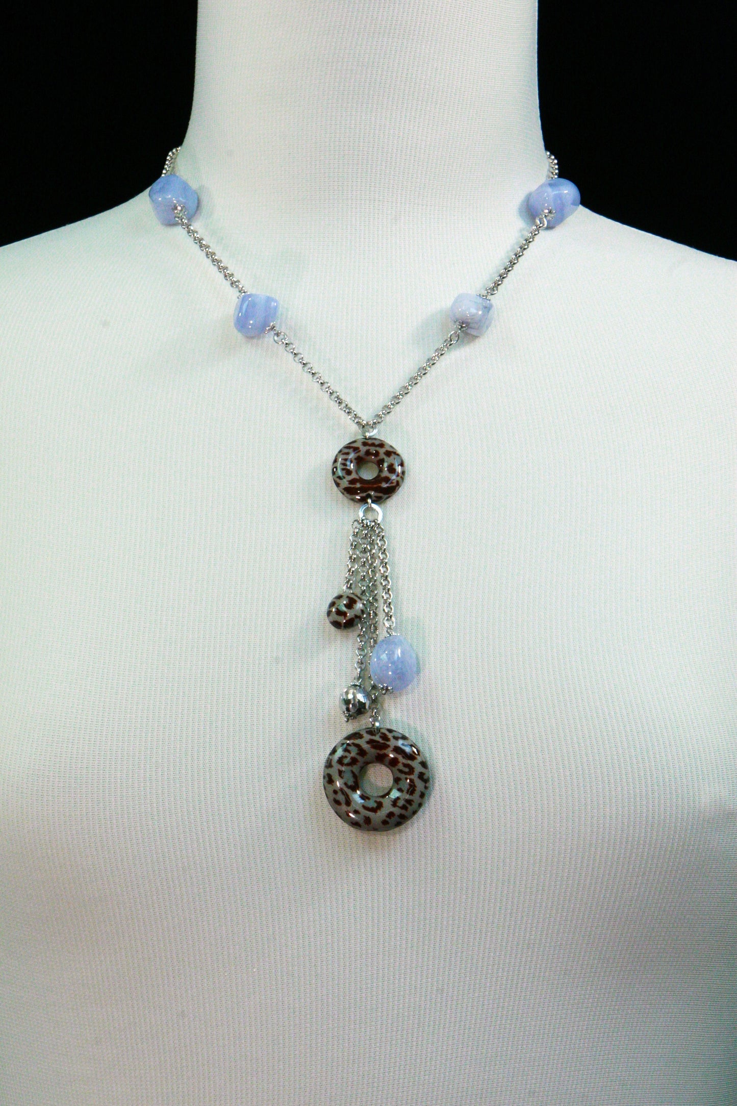 Trebor Style sterling silver Y-necklace featuring blue agate nuggets and animal print enamel beads on a tassel drop.