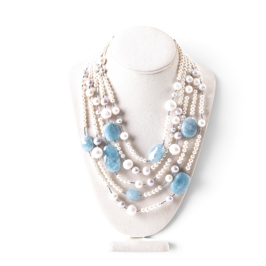 Trebor Style Rajola multi-strand necklace featuring white freshwater pearls, aquamarine gemstones, and hematite accents.