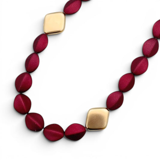 Trebor Style Loni short statement necklace with dark red oval acrylic beads and 24k gold-plated diamond-shaped beads.
