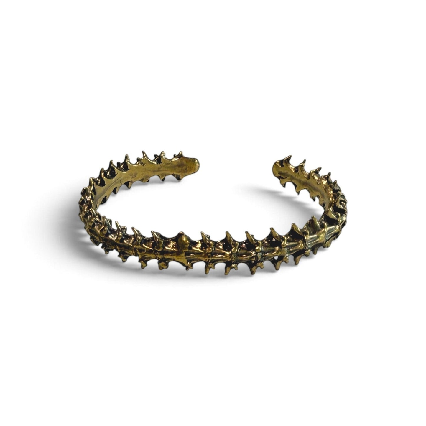 Trebor Style snake vertebrae bangle crafted from reclaimed copper and zinc in a dark metallic finish.