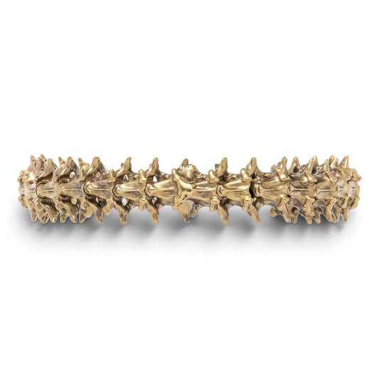 Trebor Style snake vertebrae bangle crafted from reclaimed copper and zinc in a textured, organic metallic finish.