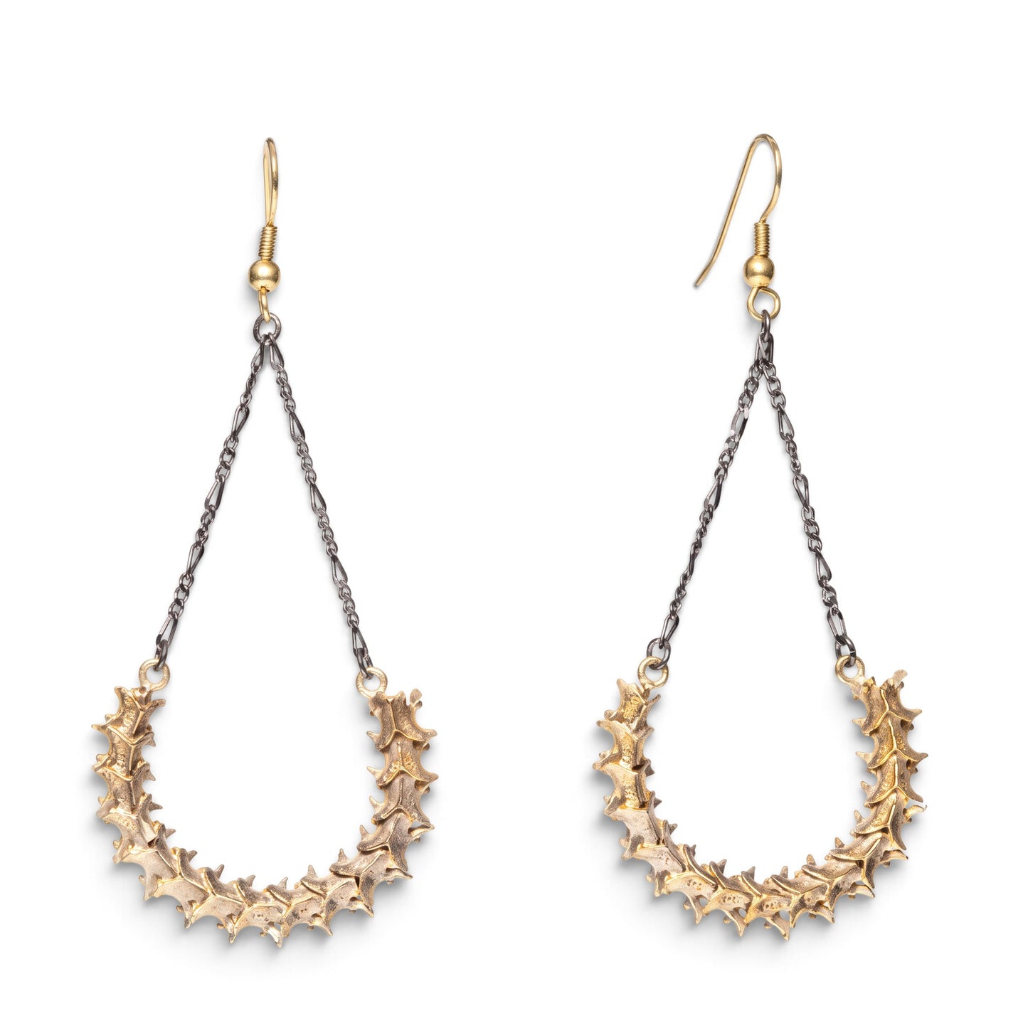 Trebor Style handmade snake vertebrae earrings with vintage chain and brass French hooks on a white background.