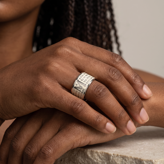 Trebor Style Tuum Animae Mater ring in sterling silver with white enamel and engraved Latin Ave Maria text on a hand.