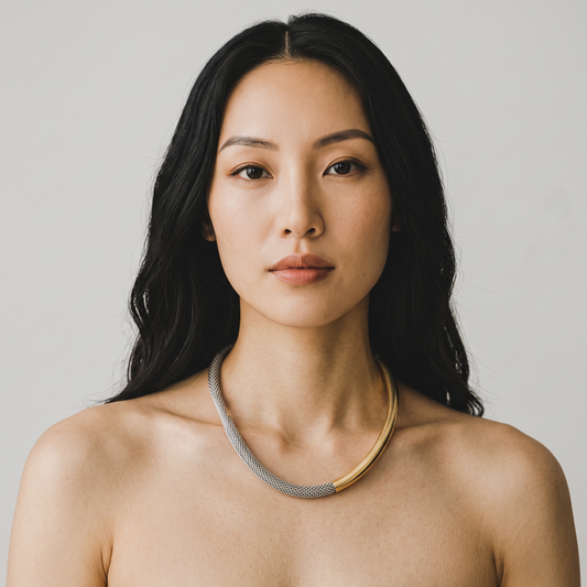Trebor Style two-tone sterling silver and 14k gold plated mesh necklace worn by a woman against a neutral background.