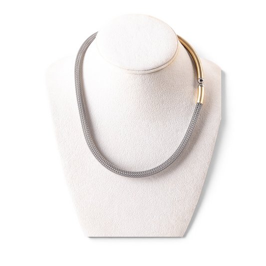 Trebor Style two-tone sterling silver mesh necklace with a 14k gold-plated accent and magnetic closure on a display.