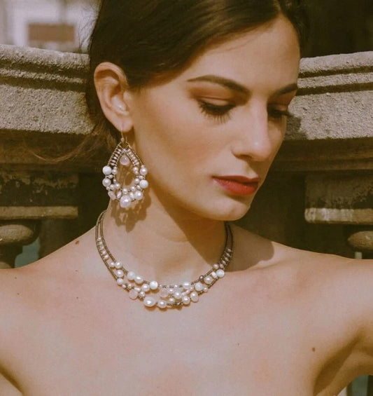 Trebor Style Ziio Shinju necklace featuring white pearls, pink morganite, and gold Murano glass beads on a model.