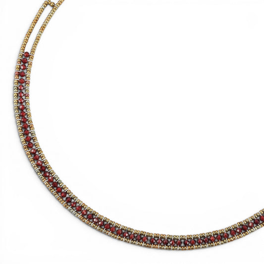 Trebor Style Ziio narrow Giro necklace featuring sparkling red zircon gemstones, Murano glass beads, and silver closure.