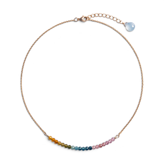 Trebor Style sterling silver necklace featuring a delicate chain and a curved bar of multi-colored tourmaline beads.
