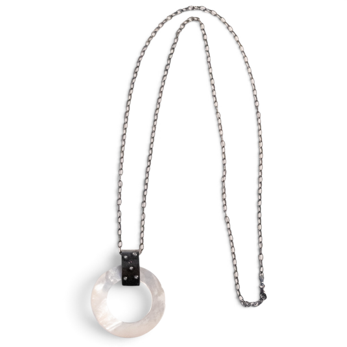 Trebor Style long necklace featuring a round mother of pearl disc pendant on an oxidized sterling silver chain.