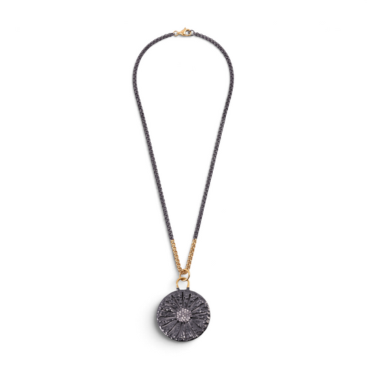 Trebor Style two-tone sand dollar pendant in oxidized sterling silver and 14k gold with pave set white sapphires.