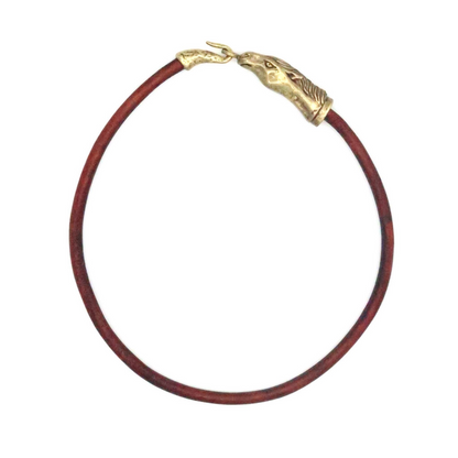 Trebor Style Wild Spirit horse choker with a brown leather cord and a sculpted gold patina horse head clasp.