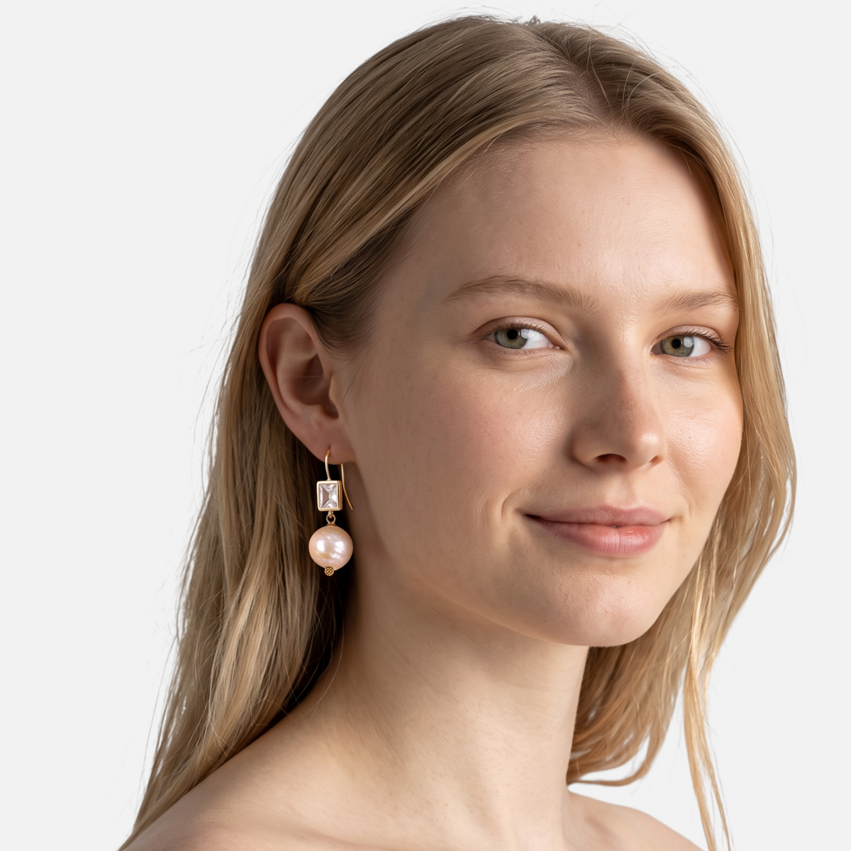 Trebor Style pink Edison pearl and square crystal drop earrings in 14k gold worn by a model