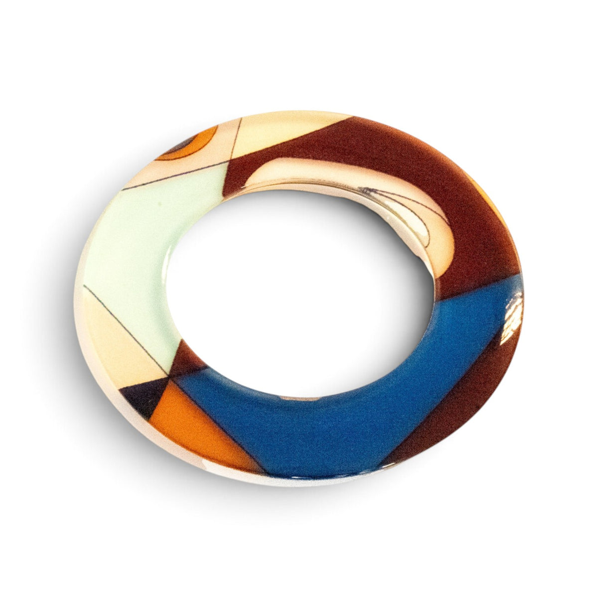 Trebor Style flat acrylic bangle featuring a hand-painted abstract motif in cream, gold, and blue triangular shapes.