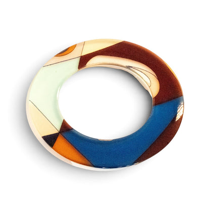Trebor Style flat acrylic bangle featuring a hand-painted abstract motif in cream, gold, and blue triangular shapes.