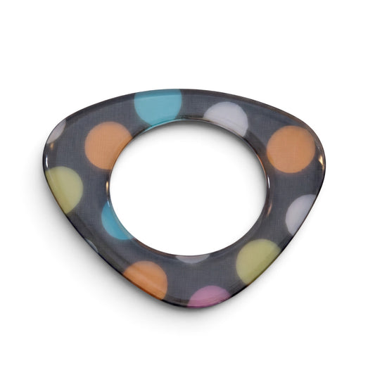 Trebor Style flat acrylic bangle featuring a triangular shape and a hand-painted multicolor polka dot pattern.