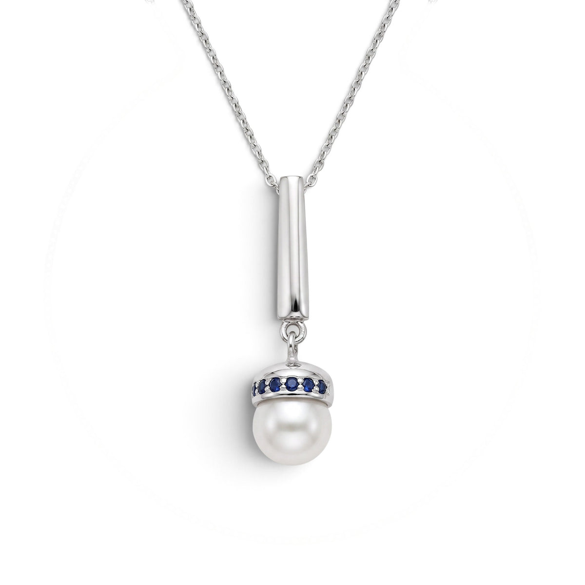 Trebor Style Akoya pearl pendant necklace with blue sapphire accents on a brushed rhodium plated sterling silver chain