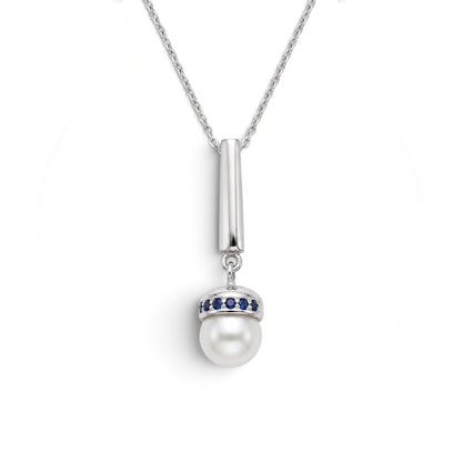 Trebor Style Akoya pearl pendant necklace with blue sapphire accents on a brushed rhodium plated sterling silver chain