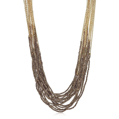Trebor Style Dolores necklace featuring 18 strands of aquamarine and pyrite beads with a 14k gold-filled cable chain.