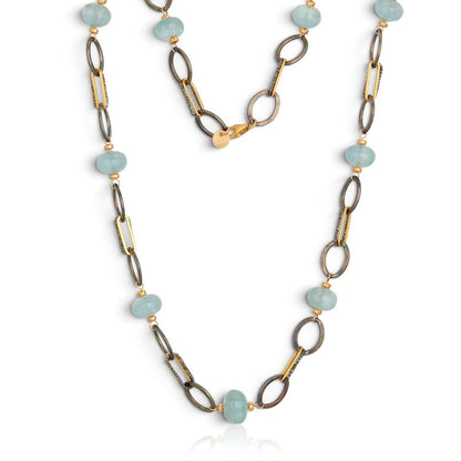 Trebor Style mixed metal necklace featuring sky blue aquamarine donut gemstones with oxidized silver and gold links.
