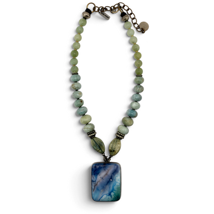 Trebor Style Masha Archer necklace with a marbled glass pendant, aquamarine quartz, jade beads, and ceramic accents.