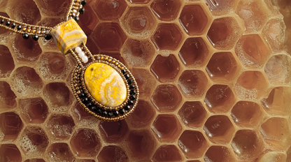Trebor Style Arkanis bumblebee necklace featuring yellow jasper, bronze, gold, and black beads on a honeycomb background.