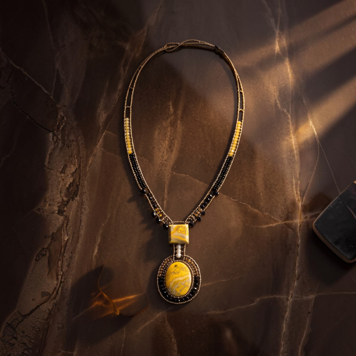 Trebor Style Arkanis bumblebee necklace featuring yellow jasper, bronze, gold, and black beads with a white pearl.