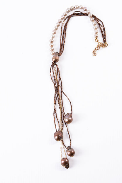 Trebor Style asymmetrical Y-necklace featuring cream freshwater pearls, bronze pyrite beads, and 18k gold chain accents.