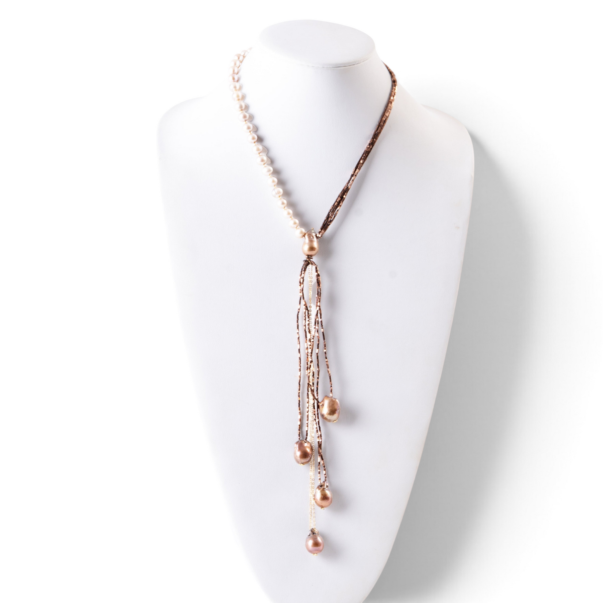 Trebor Style asymmetrical Y-necklace featuring cream freshwater pearls, bronze pyrite beads, and baroque pearl drops.