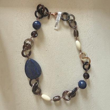 Trebor Style asymmetrical necklace featuring natural horn, blue lapis, smokey quartz, and white agate on rose gold chain