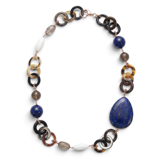 Trebor Style asymmetrical necklace featuring natural horn rings, blue lapis, smokey quartz, and white agate gemstones.