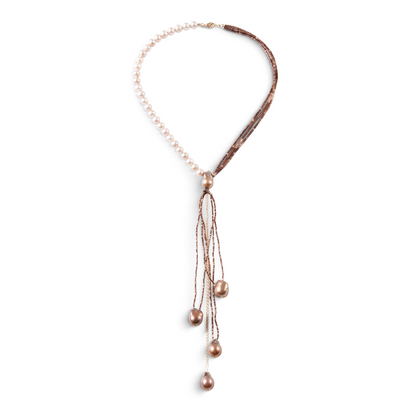Trebor Style asymmetrical Y-necklace featuring cream freshwater pearls, bronze pyrite beads, and baroque pearl drops.