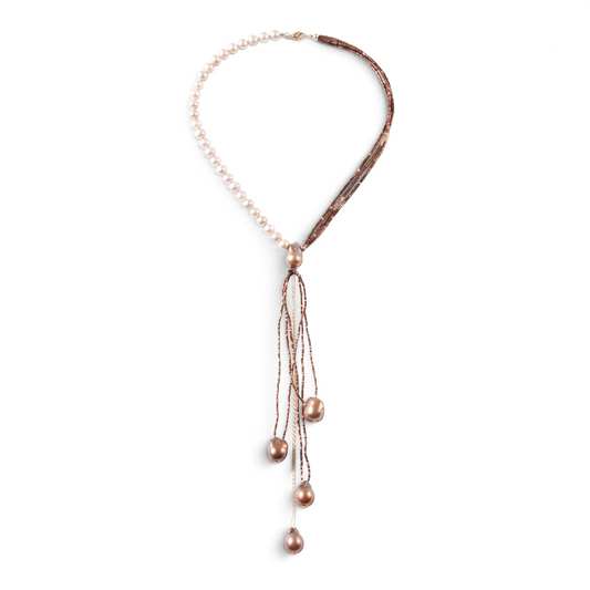 Trebor Style asymmetrical Y-necklace featuring cream freshwater pearls, bronze pyrite beads, and baroque pearl drops.
