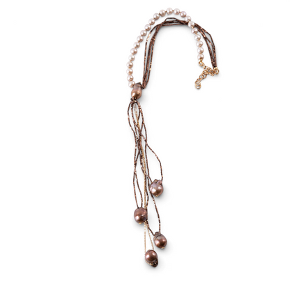 Trebor Style asymmetrical Y-necklace featuring cream freshwater pearls, bronze pyrite beads, and baroque pearl drops.