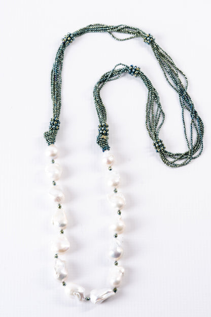 Trebor Style long necklace featuring large white baroque pearls and multi-strand green hematite seed beads.