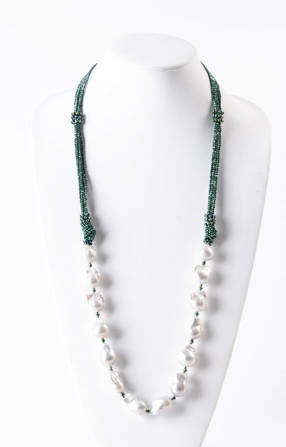 Trebor Style long necklace featuring large white baroque pearls and multi-strand green hematite seed beads.