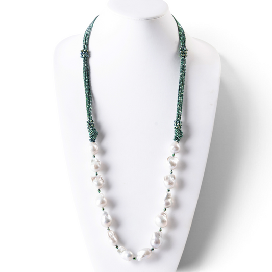 Trebor Style long necklace featuring large white baroque pearls and multi-strand green hematite seed beads.