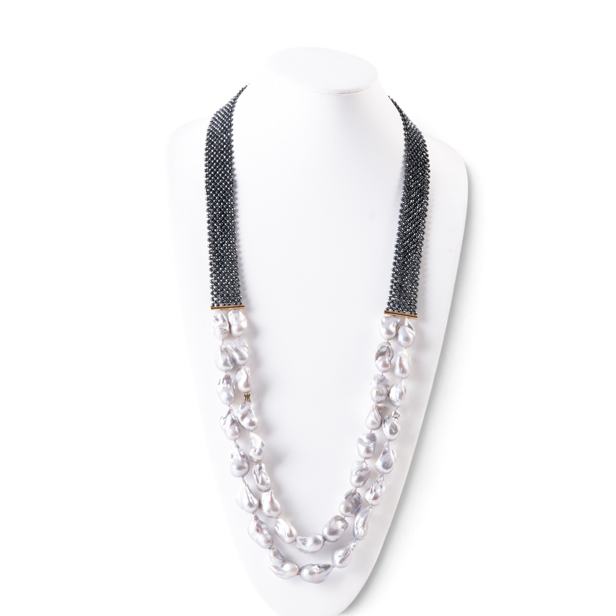 Trebor Style double strand necklace featuring grey baroque pearls, faceted hematite beads, and an 18k gold bar accent.