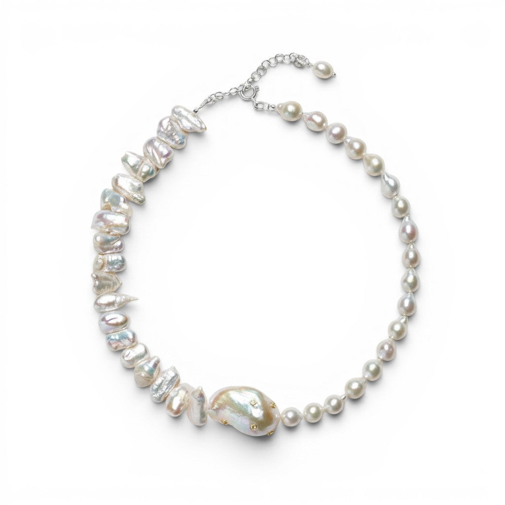 Trebor Style baroque pearl necklace featuring a large central pearl with gold zircon accents on a silver chain