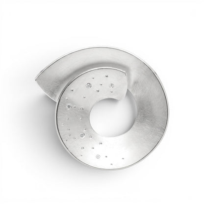Trebor Style Bastian sterling silver open swirl pendant with diamond dust texture on a brushed circular design
