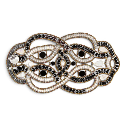 Trebor Style intricate statement bracelet featuring woven black onyx beads, white freshwater pearls, and metallic accents.