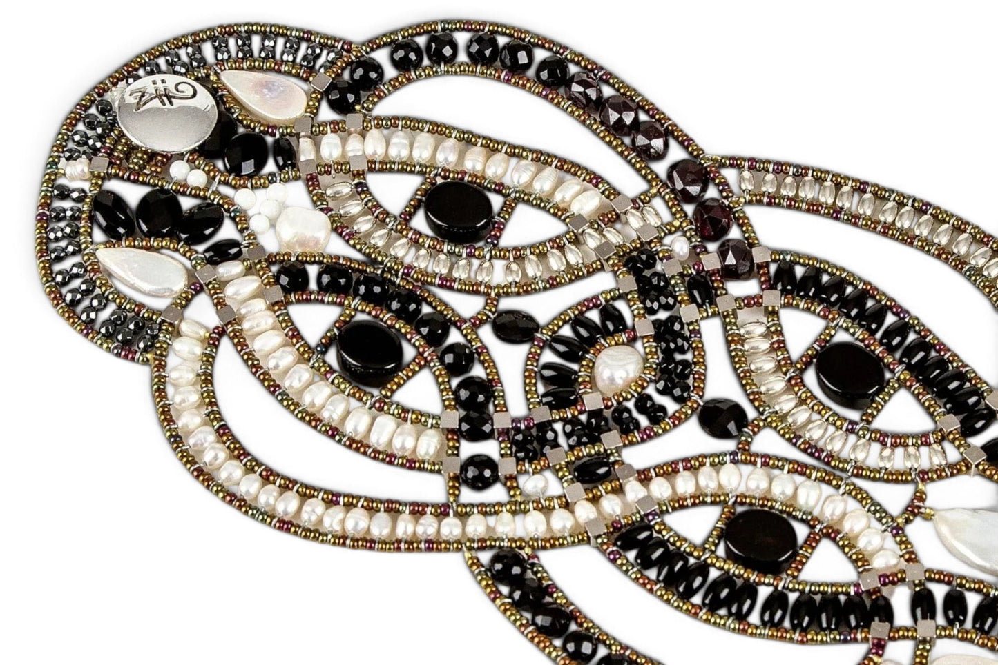 Trebor Style artisan statement bracelet featuring woven black onyx, white freshwater pearls, and metallic beadwork.