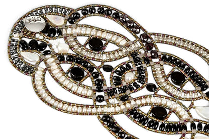 Trebor Style artisan statement bracelet featuring woven black onyx, white freshwater pearls, and metallic beadwork.