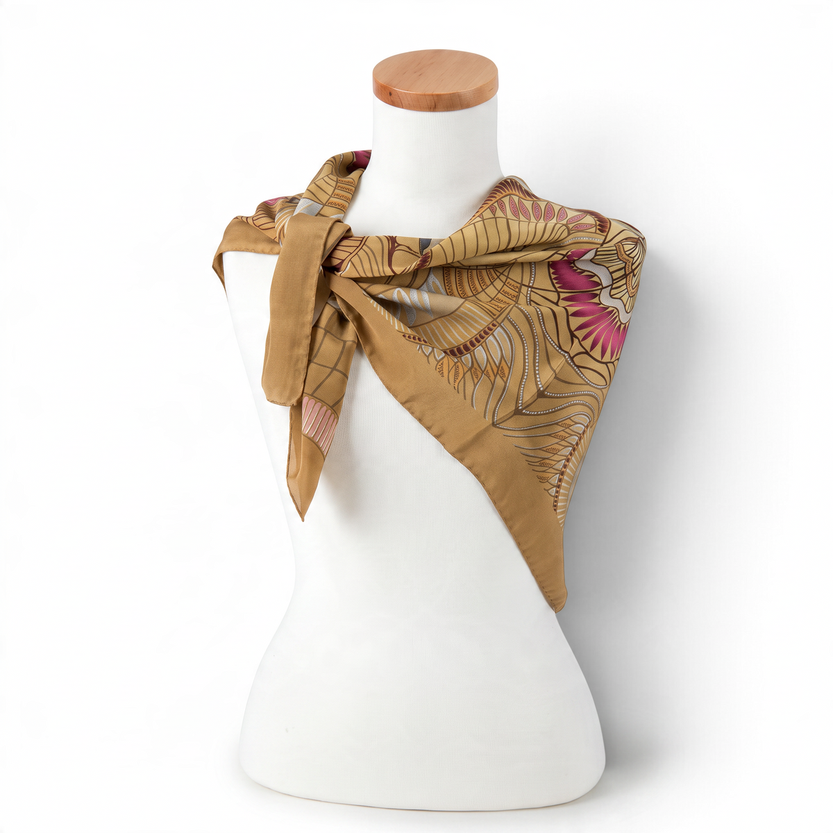 Trebor Style beige silk crepe square scarf with jungle print in gold, tan, pink, and blue on a mannequin