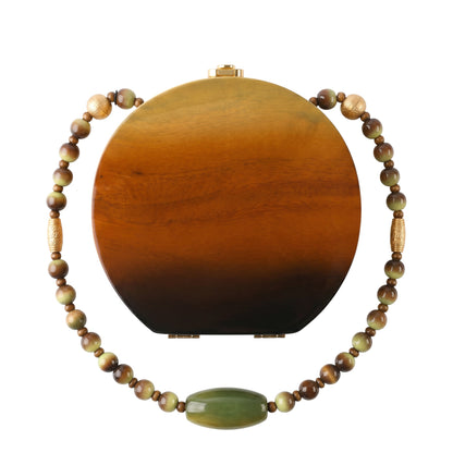 Trebor Style Binn wooden collectible handbag in a circular acacia wood design with a beaded shoulder strap.