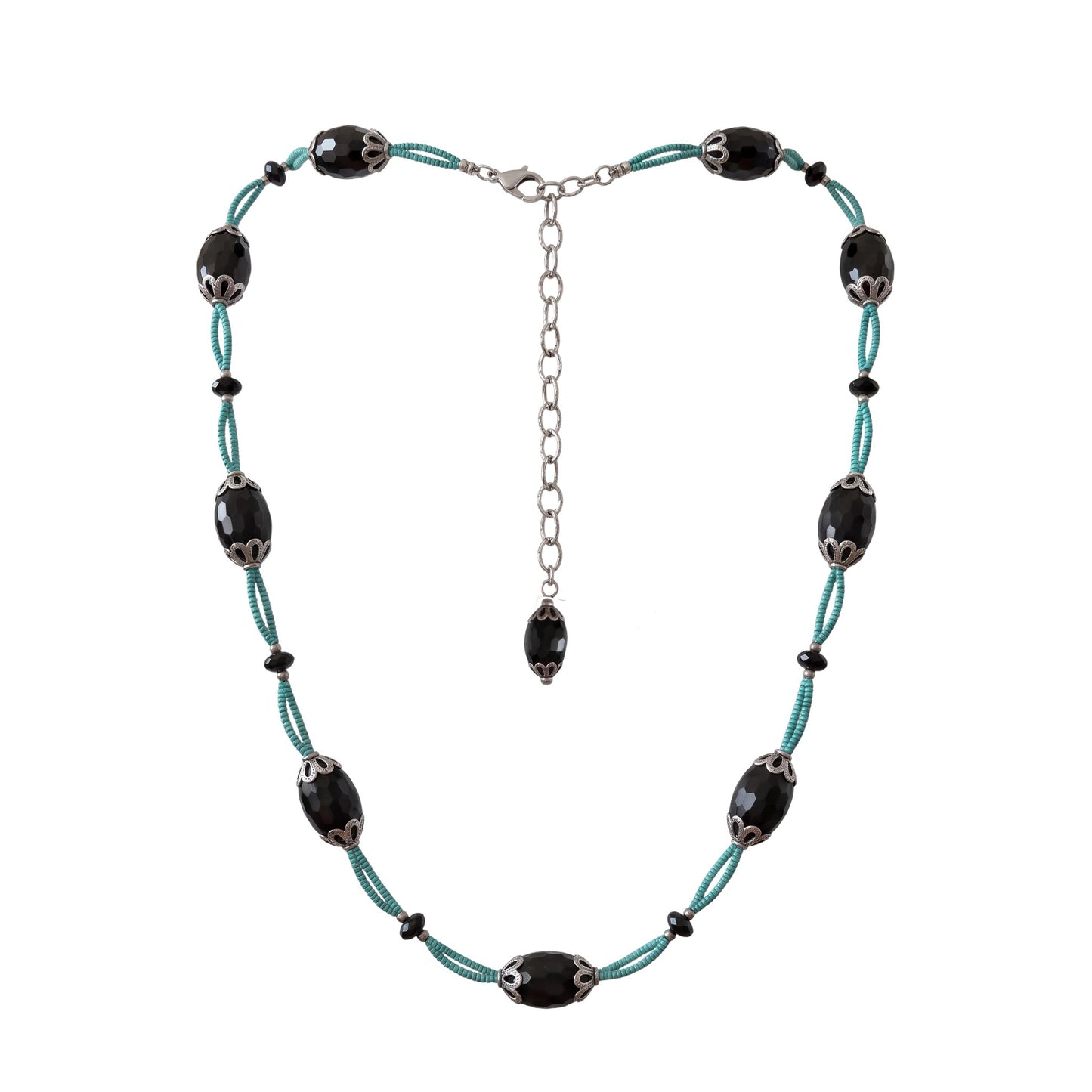 Trebor Style necklace with faceted black agate ovals, silver filigree caps, and turquoise thread on a silver chain.