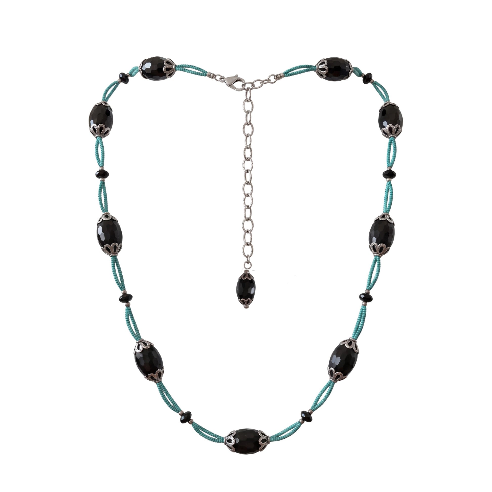 Trebor Style necklace with faceted black agate ovals, silver filigree caps, and turquoise thread on a silver chain.