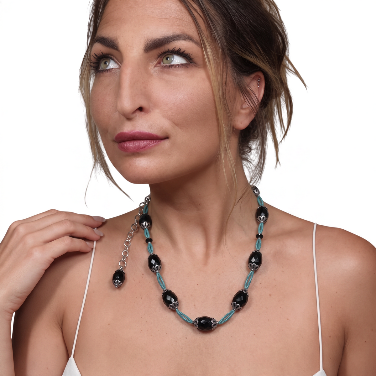 Trebor Style black agate and turquoise thread necklace with silver filigree accents worn by a woman